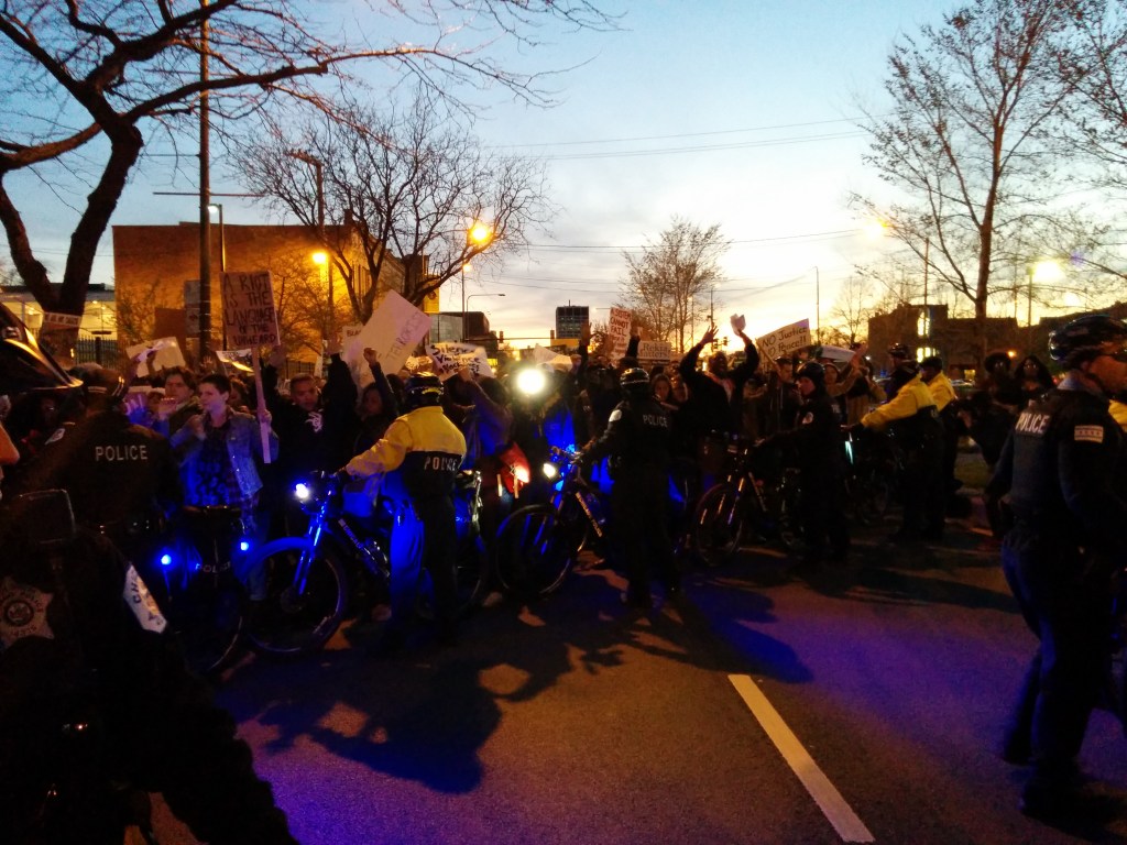 Police fail to contain the crowd as the march spills out into the street Tuesday night on Chicago's South Side. (Photo: Kelly Hayes)