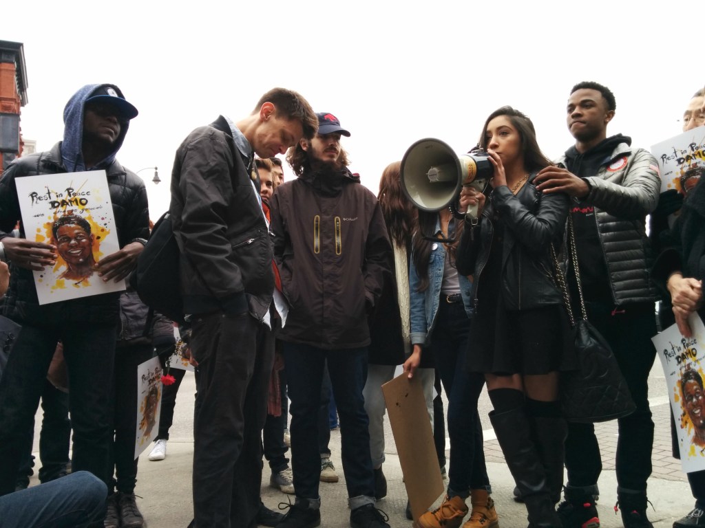 Damo's friends comfort each other as they tell stories about what he meant to them - including a narrative about how Damo (not the police) once saved a group of friends from being mugged. (Photo: Kelly Hayes)